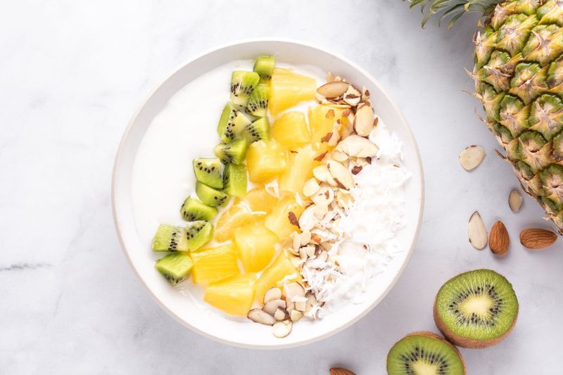 Yogurt With Mango Chunks And Coconut Flakes