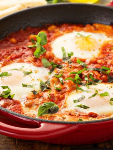 Shakshuka with chickpeas in a cast iron skillet