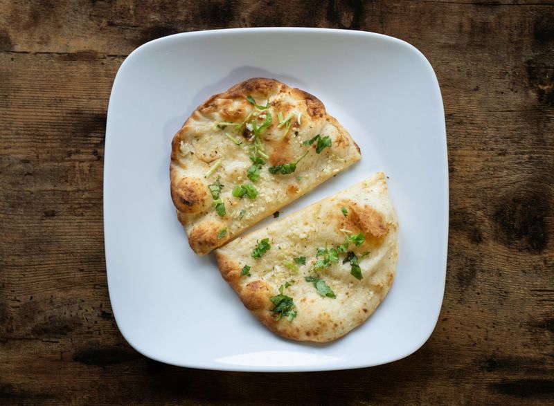 A Plate of a Cheese Garlic Naan