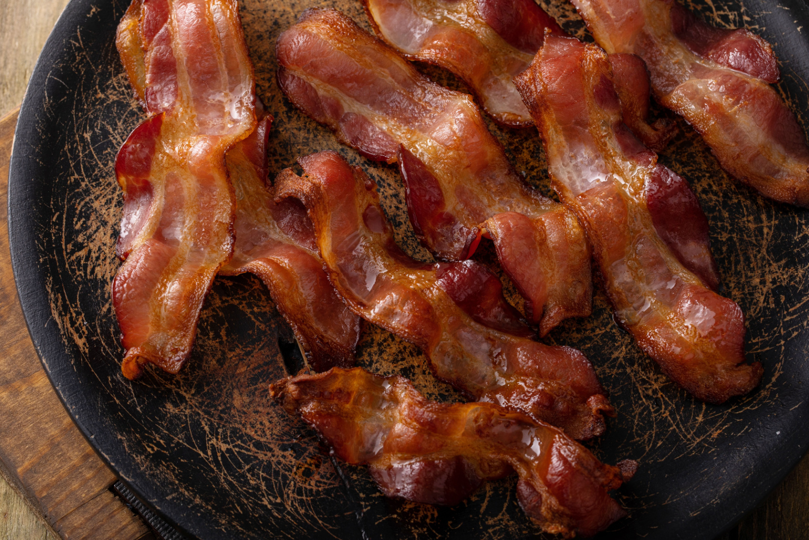 Cooked bacon on a serving platter skillet ready to eat for breakfast