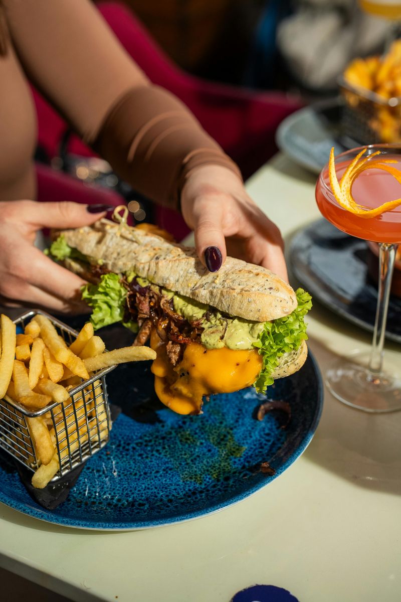 Delicious Sandwich and Fries on Blue Plate