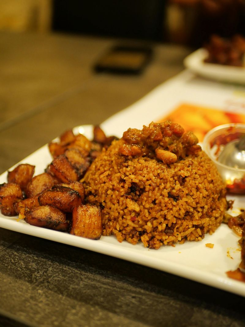 Fried Cubes and Rice on White Plate