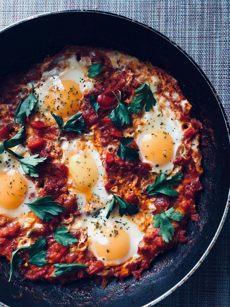 Delicious fried eggs and tomatoes in morning