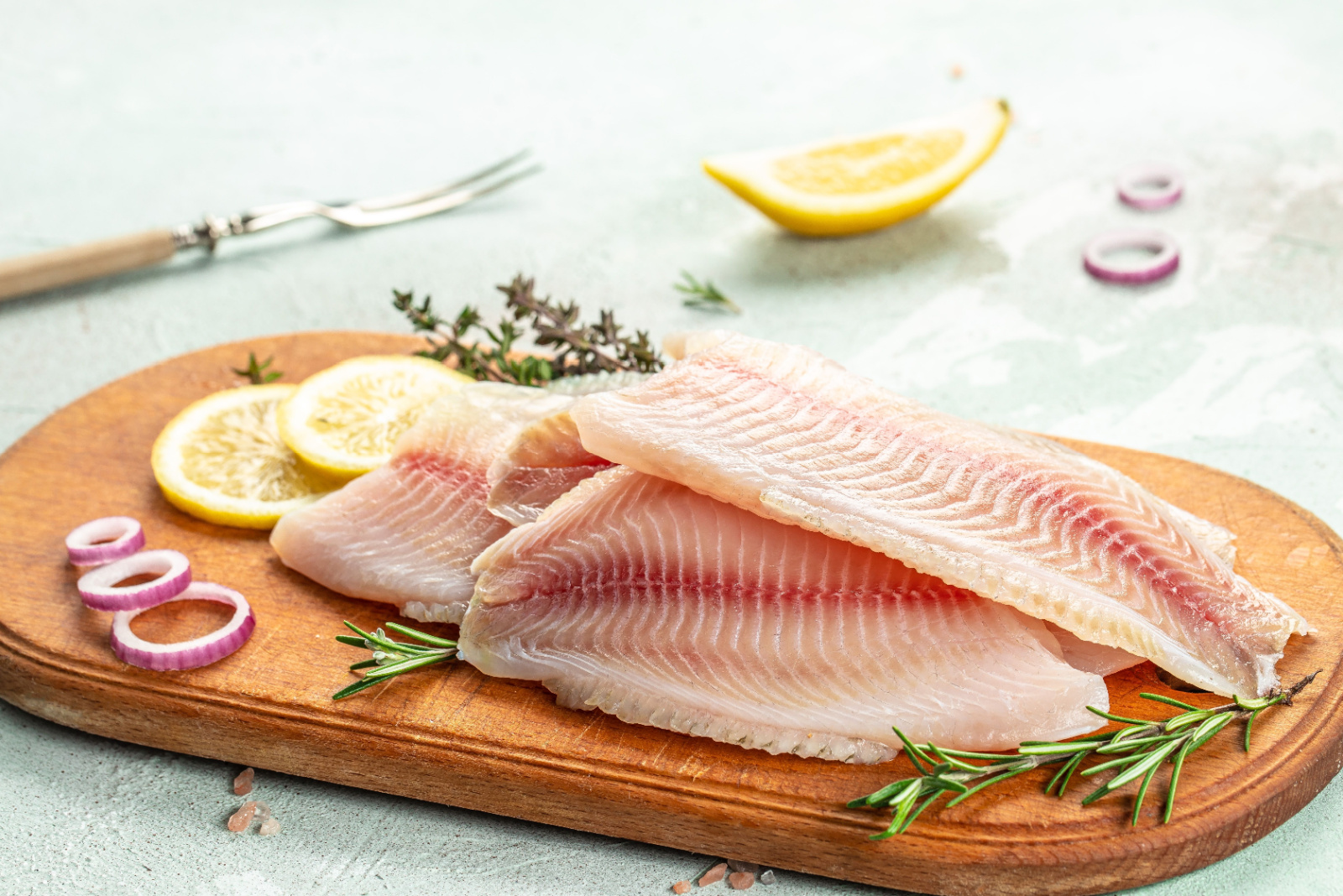 White fish tilapia fillet ready to cook. superfood concept. Healthy, clean eating.