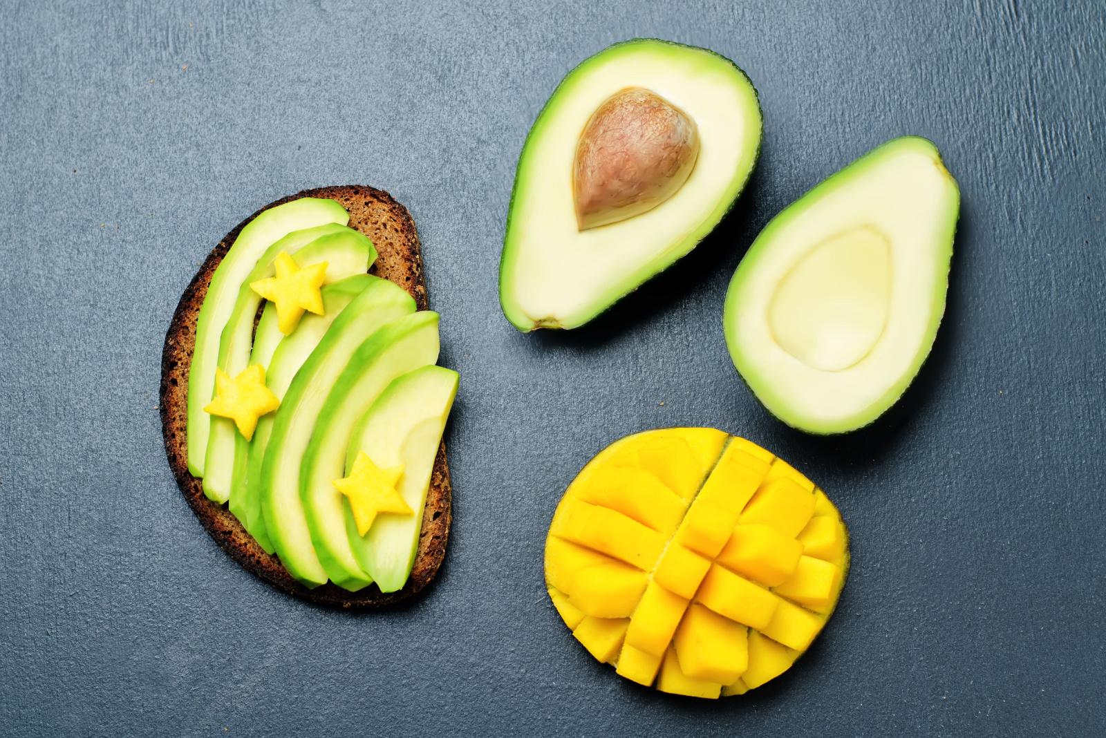Mango avocado rye breakfast sandwich. toning. selective focus