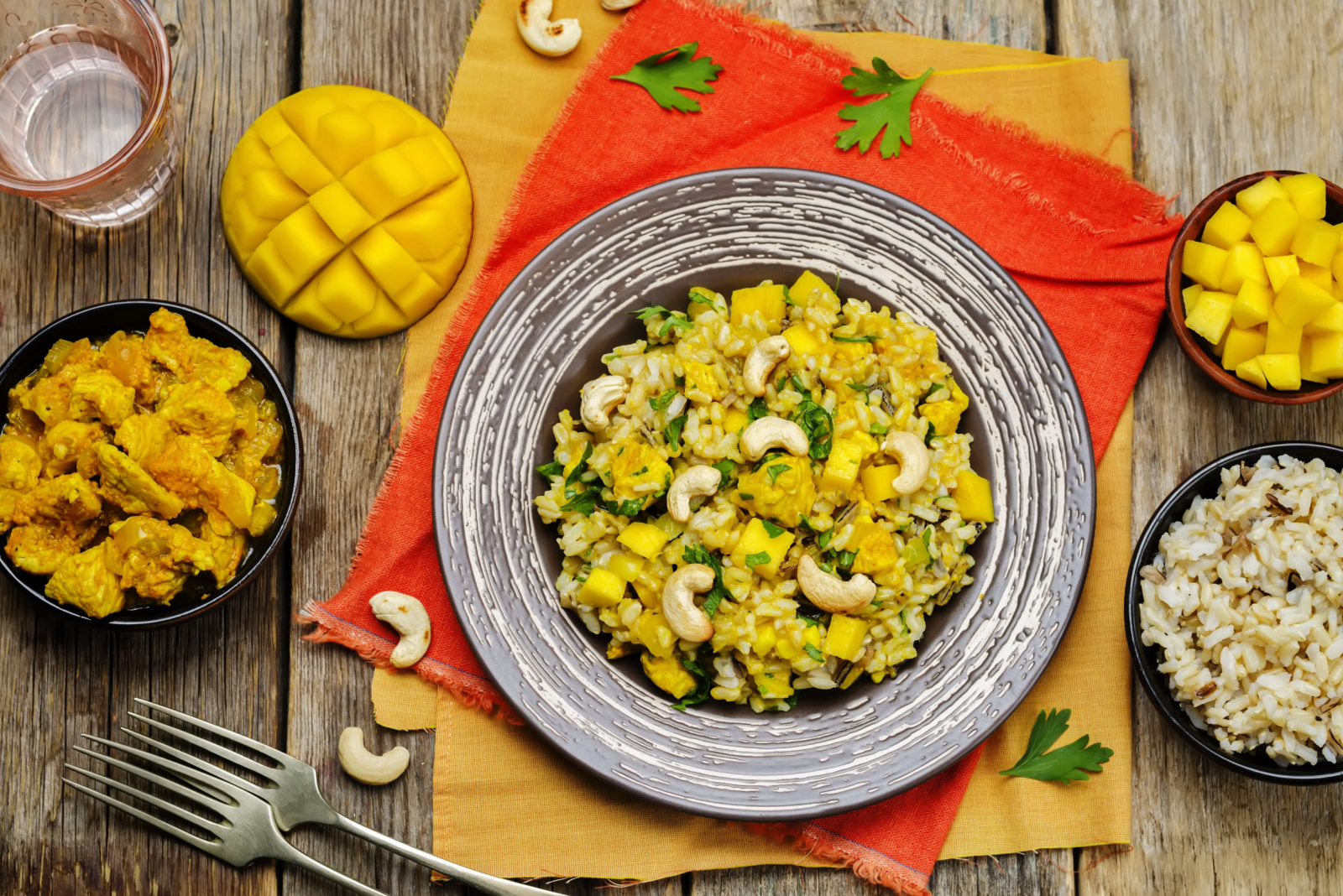 Curry chicken rice with mango on wood background. toning. selective focus