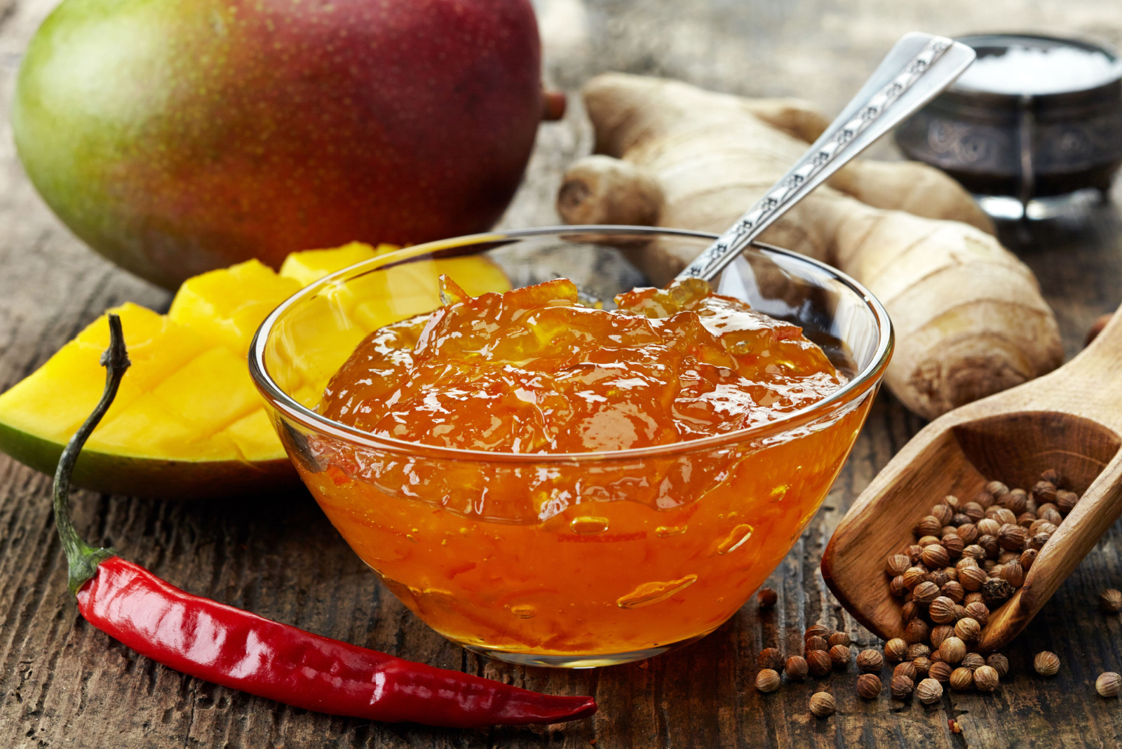 Bowl of Mango Chutney on wooden table
