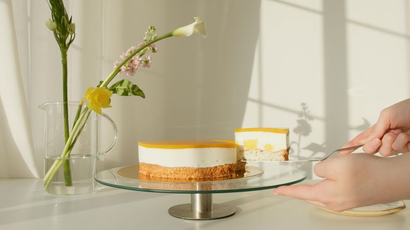 A Person Getting a Slice of Cake
