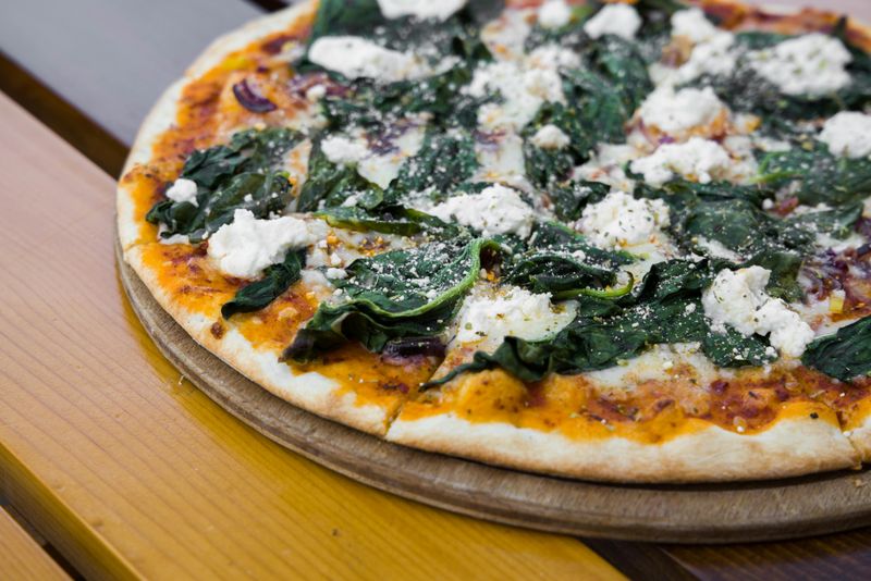 Pizza on Top of a Wooden Table