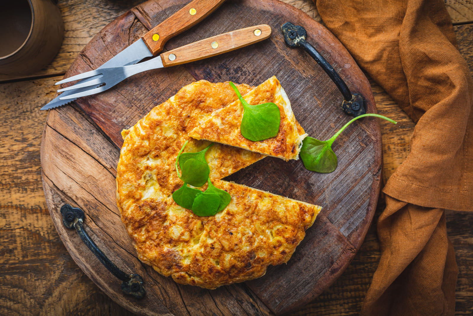 Spanish omelet (Tortilla de patatas) with potatoes and onion, typical Spanish cuisine. 