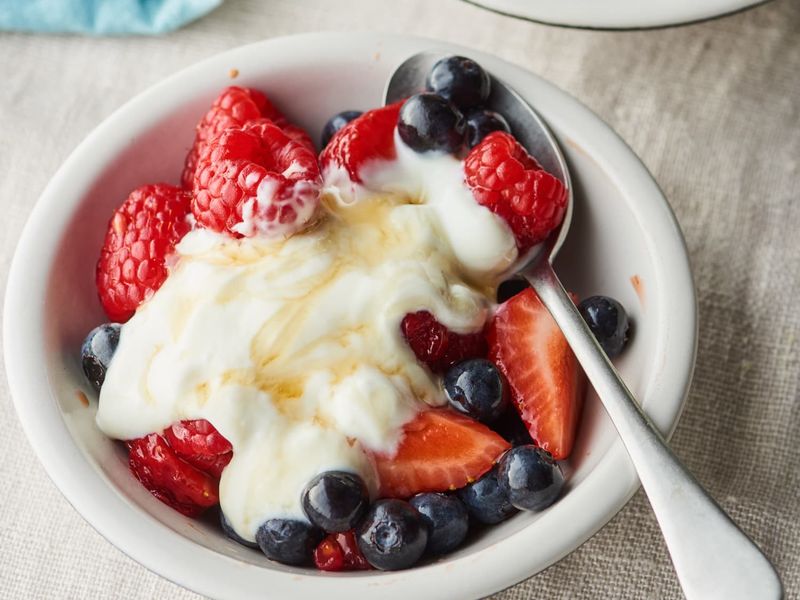 Greek Yoghurt With Berries And A Drizzle Of Honey