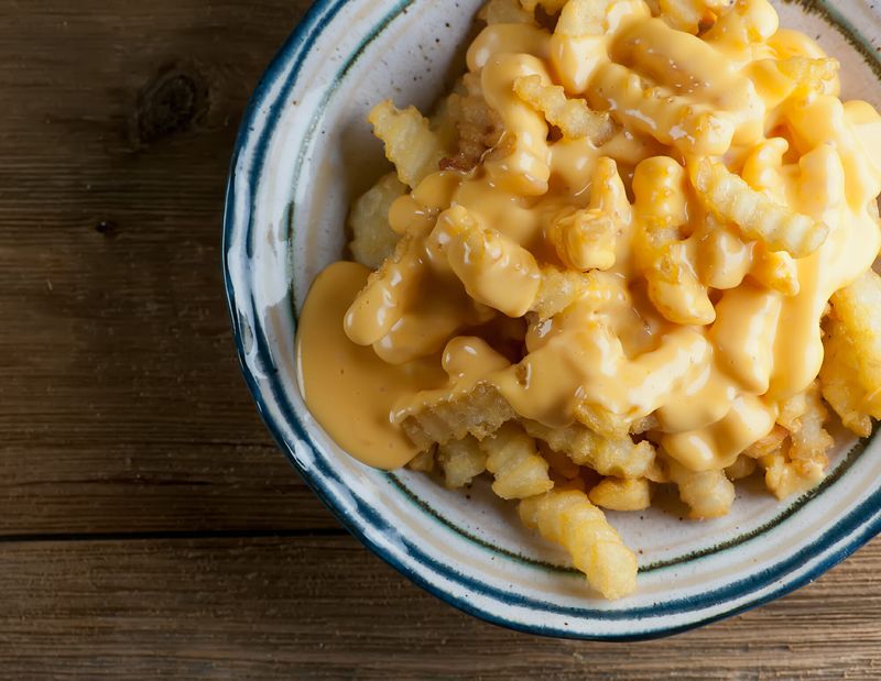 Overloaded Cheese Fries Drenched In Sauce