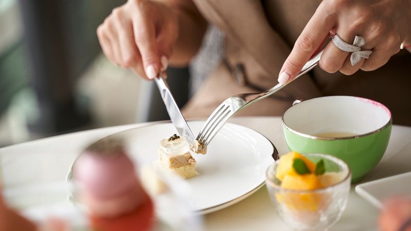 Using The Fork In The Left Hand And Knife In The Right