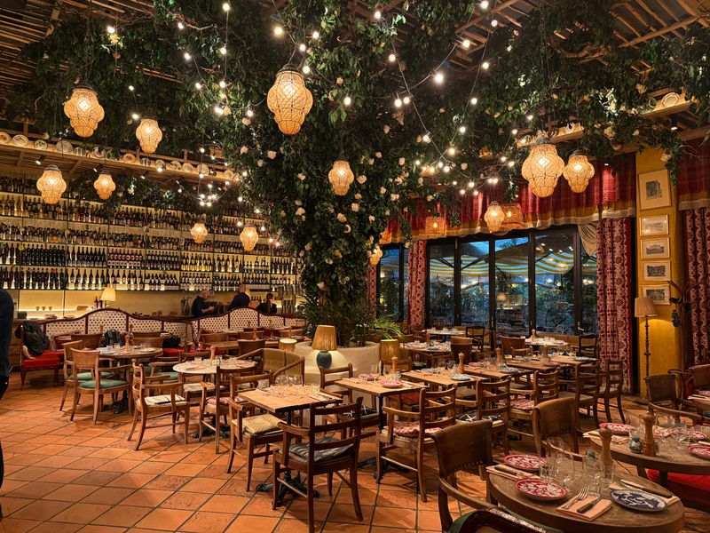 Walls Of Bottles And Ceilings Draped In Fairy Lights