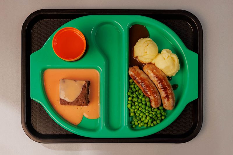 School Dinners Served On Compartment Trays