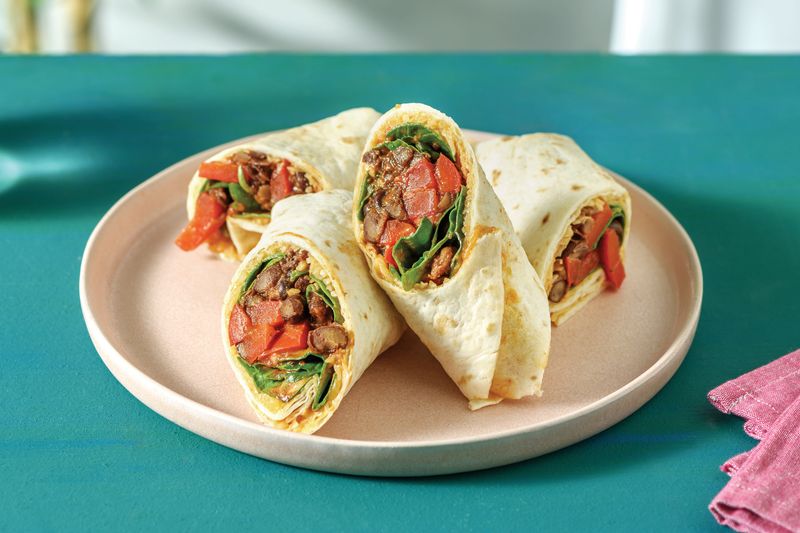 Tortilla Wraps With Beans, Salad, And Cheese