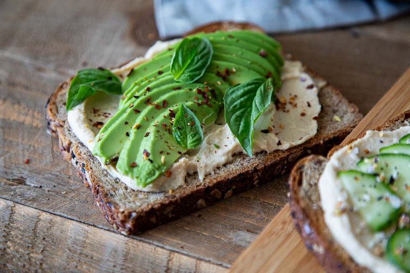 Avocado And Hummus Toast On Wholegrain Bread