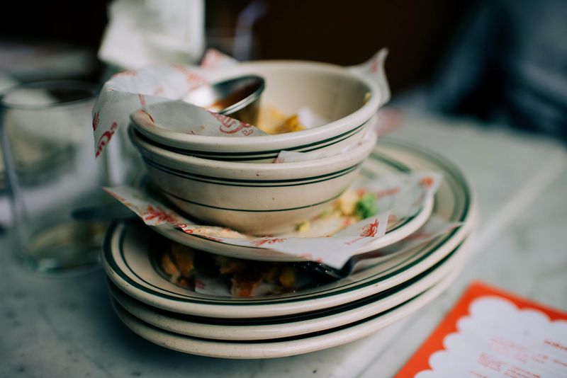 Stacking Plates Or Tidying The Table Slightly