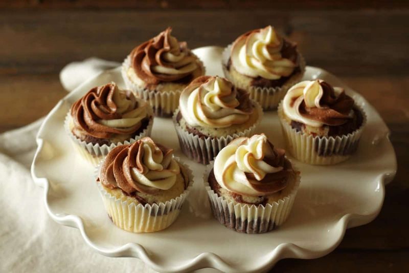 Chocolate And Vanilla Cupcakes With Swirled Frosting