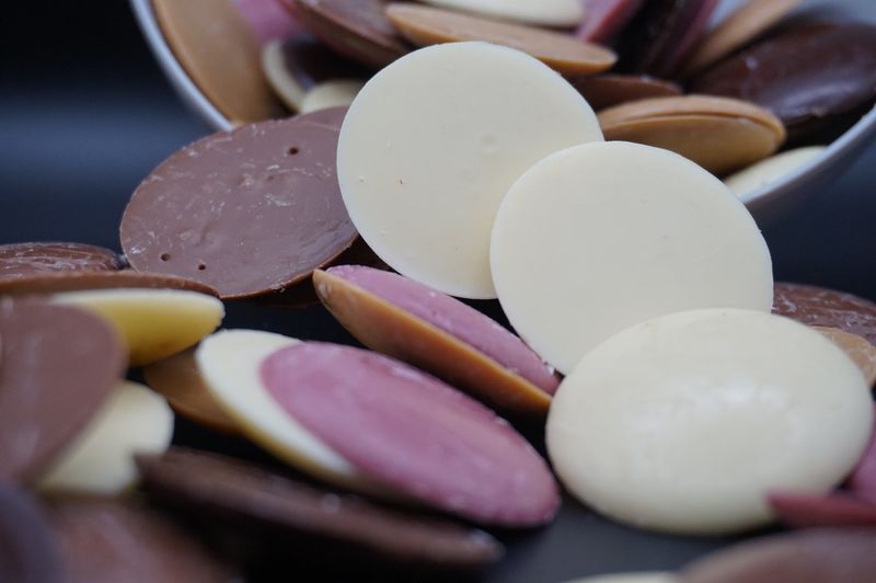 Chocolate Buttons Or Sweets Grabbed In Passing