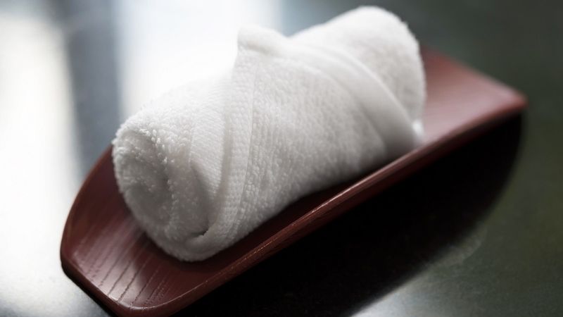Using Wet Towels (Oshibori) To Clean Hands Before Eating