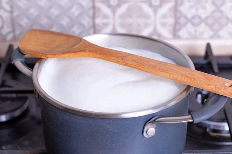 A Wooden Spoon Stops A Pan From Boiling Over