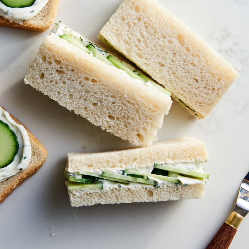 Serving Finger Sandwiches With Tea