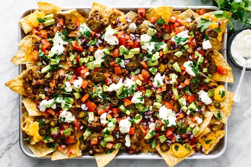 Loaded Nachos With Refried Beans And Cheese