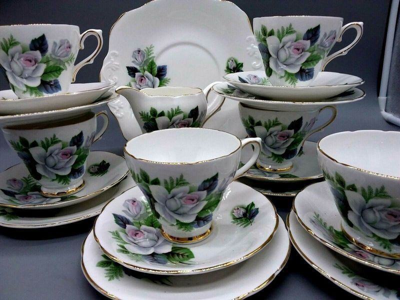 Pouring Tea Into Fine China Cups
