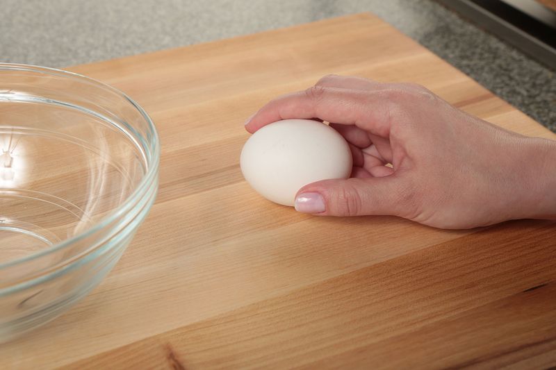 Crack Eggs on a Flat Surface, Not the Bowl Edge