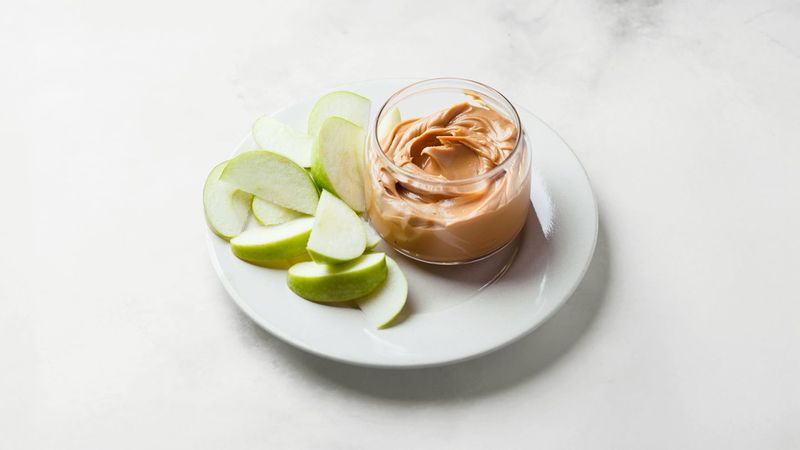 Almond Butter and Apple Slices on Whole Grain Crackers