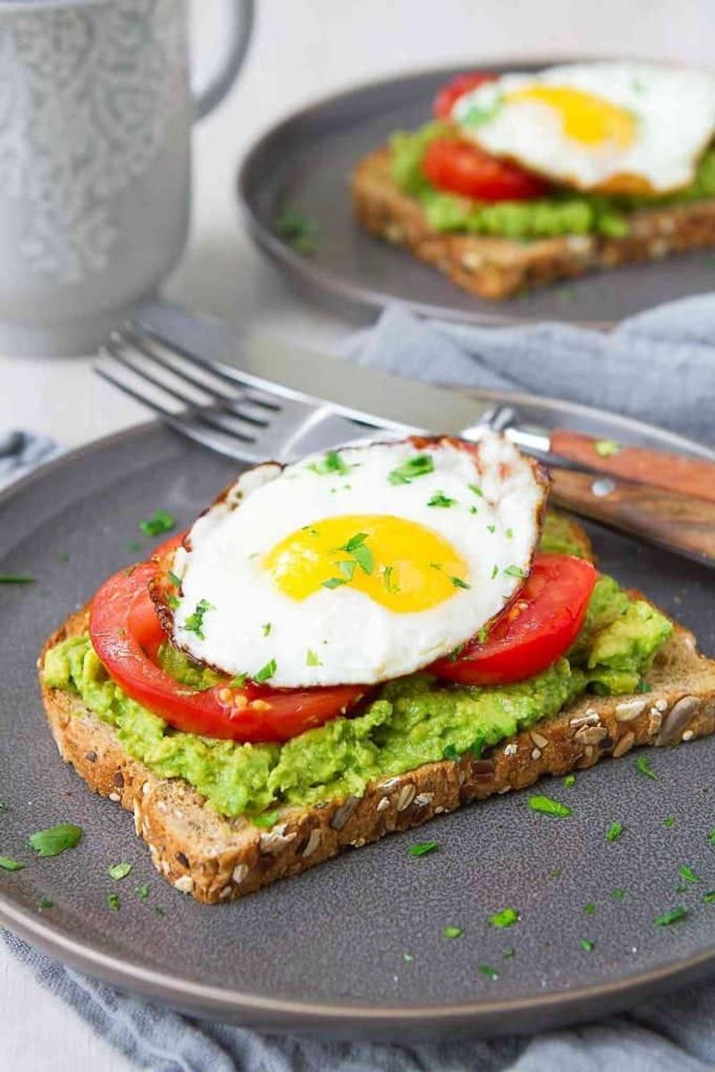 Avocado and Egg Toast on Whole Grain Bread