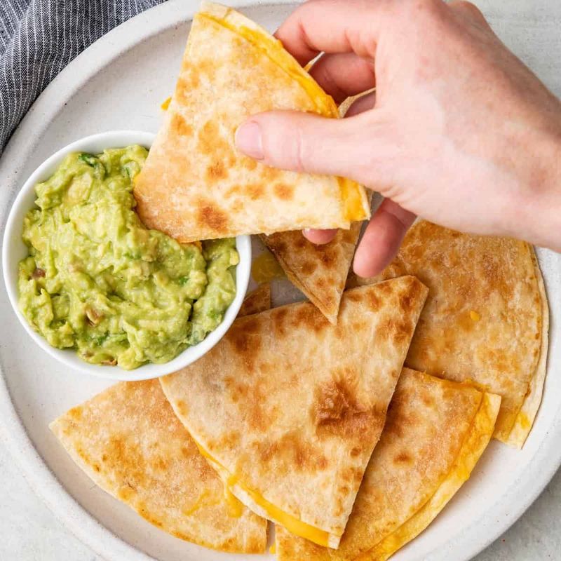 Mini Cheese Quesadilla Triangles with Guacamole