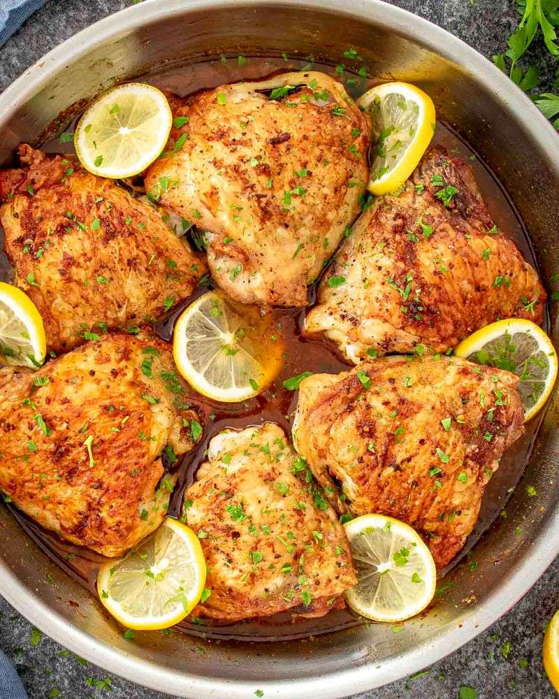 Crispy Sheet Pan Chicken Thighs With Lemon And Garlic Over Rice
