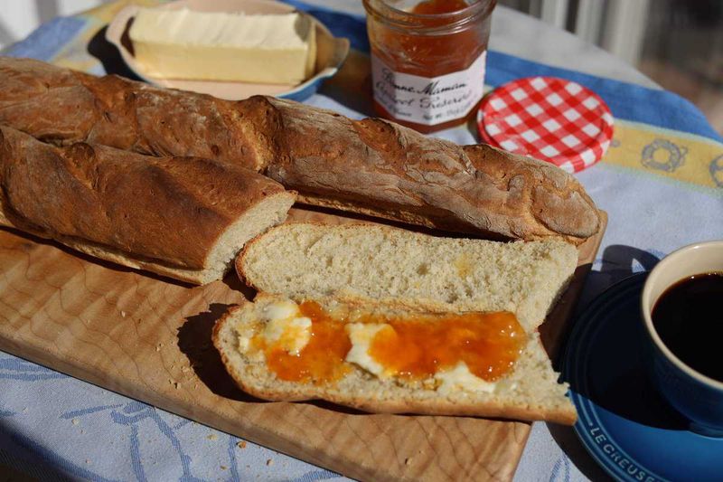 Spreading Butter and Jam on a Baguette, Not Toast