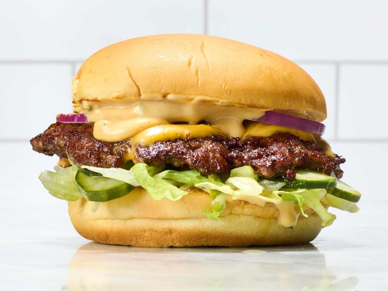 Smashed Burgers On Potato Rolls With American Cheese And Pickles
