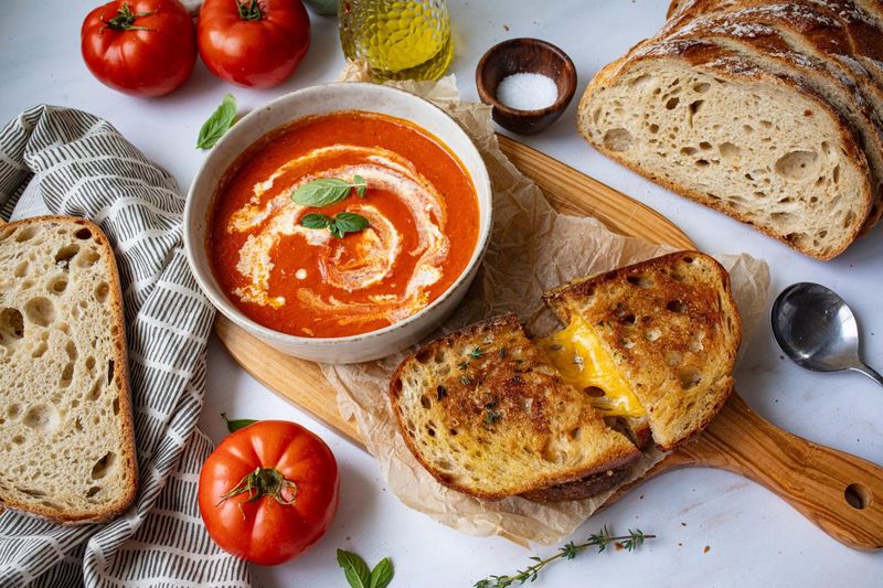 Roasted Tomato Soup With A Grilled Cheese Sandwich On Sourdough