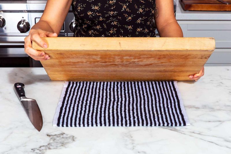Put a Damp Paper Towel Under Your Cutting Board to Stop It from Sliding