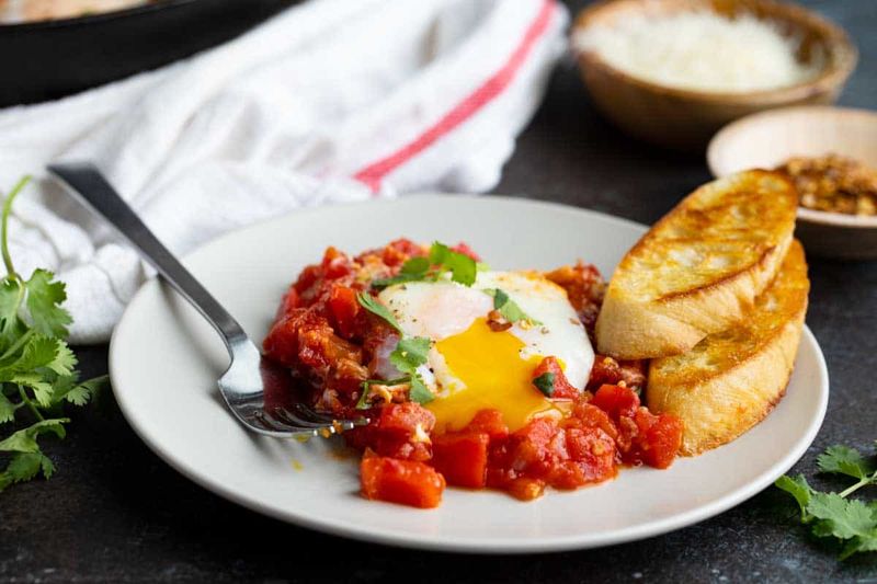 Leftover Shakshuka Eggs with Feta and Crusty Bread