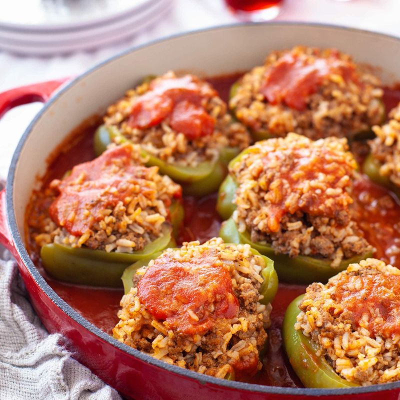 Stuffed Bell Peppers Sitting in a Savory Tomato Beef Gravy