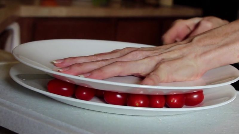 Slice Cherry Tomatoes in Seconds with Two Lids