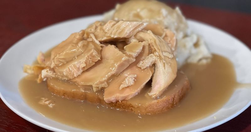 Open-Faced Turkey Sandwich Drowning in Gravy