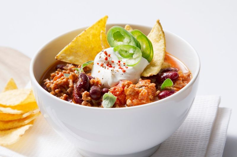 Chili Con Carne with Pickled Jalapenos and Sour Cream