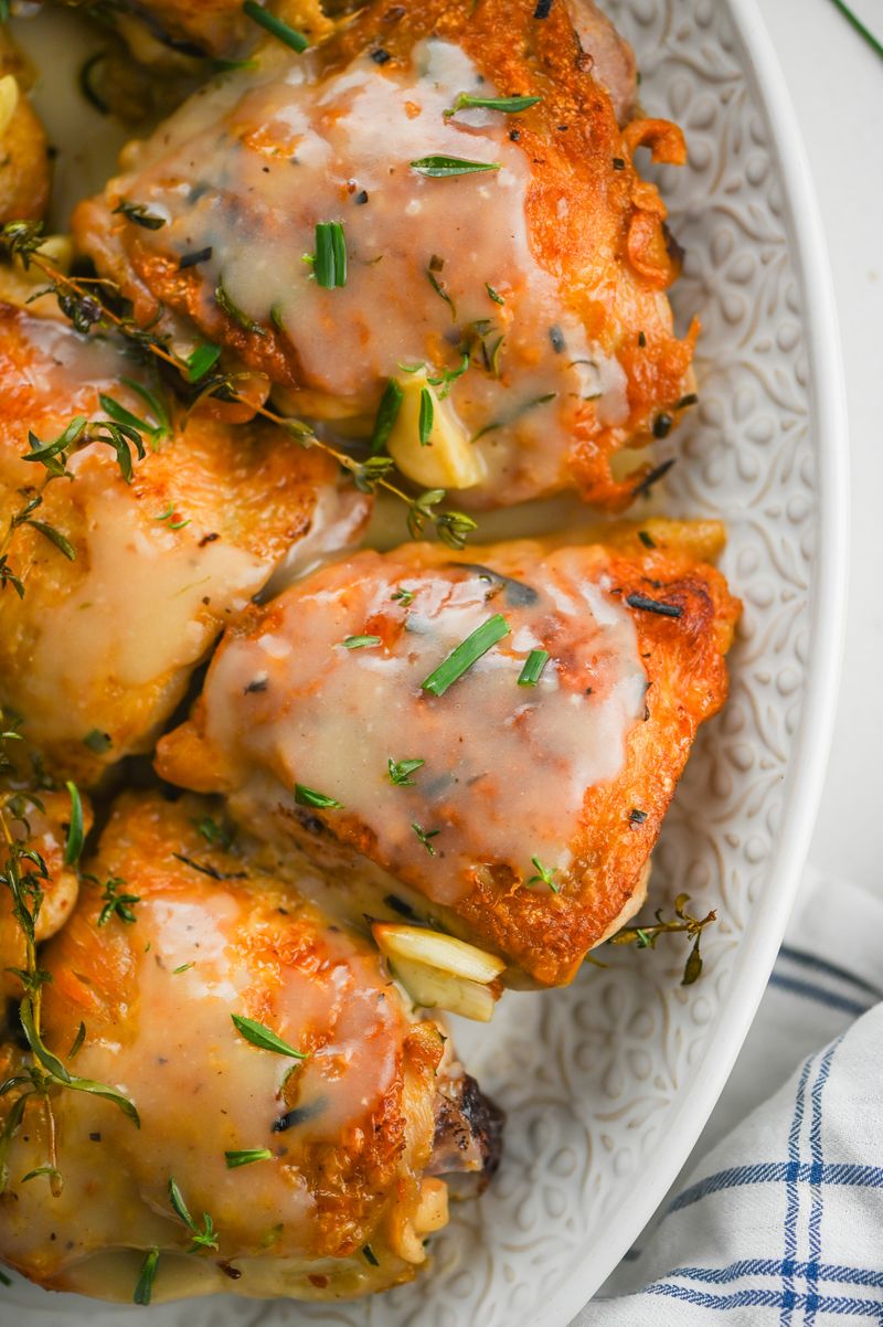 Roasted Chicken Thighs Nestled in Garlic Herb Gravy