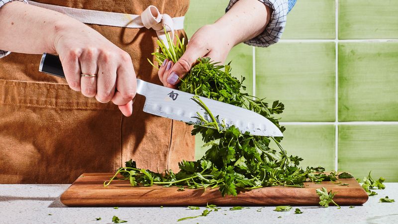 Fresh Herbs Being Chopped