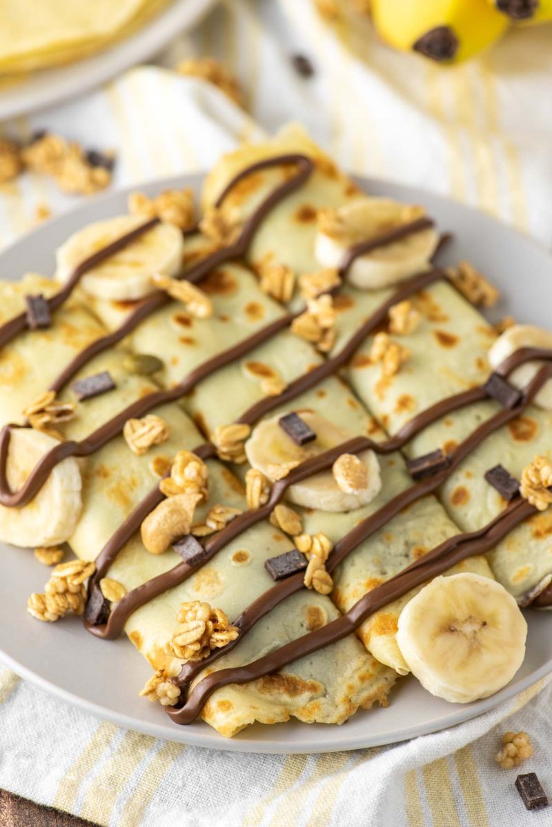 Peanut Butter and Banana Stuffed Crepe with Dark Chocolate Drizzle