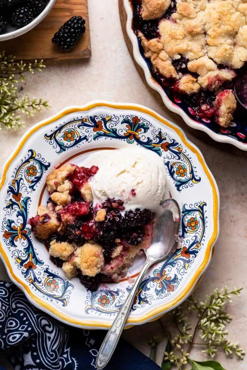 Blackberry Crumble With Whipped Cream And Fresh Berries