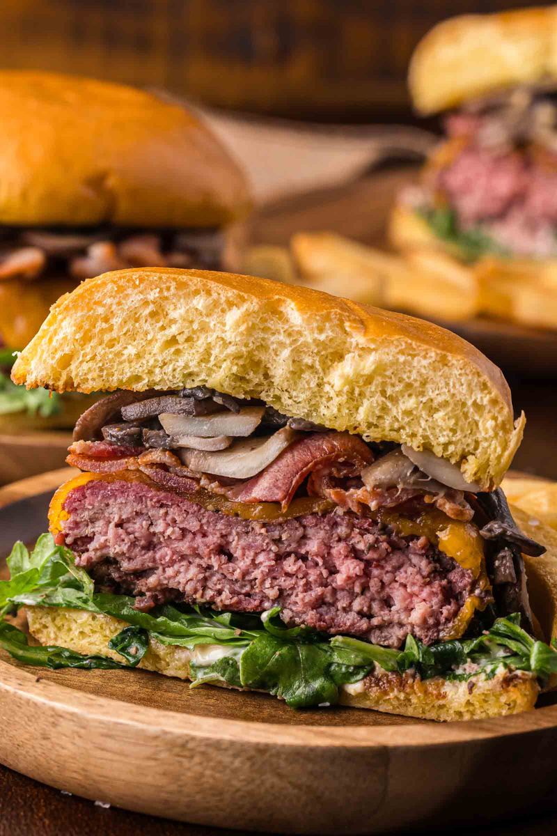 The Last Bite of a Burger With Everything in It