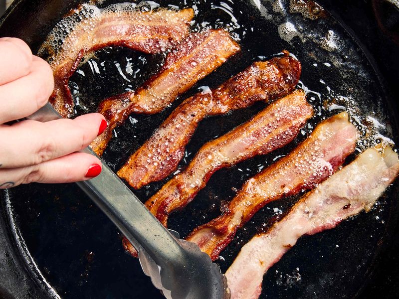 Bacon Popping and Spitting on a Griddle