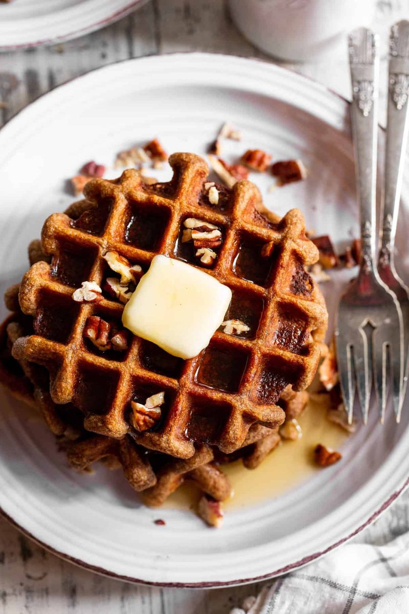 Banana Oat Waffles with Maple Syrup and Pecans